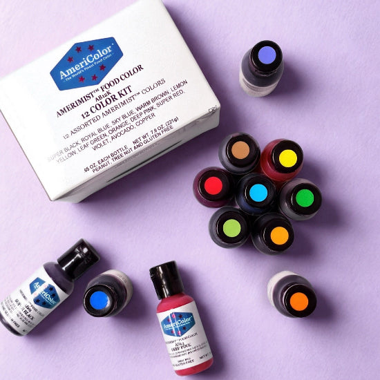 AmeriColor food color kit with various bottles on a purple background