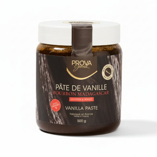 A 500g jar of Prova Gourmetes Bourbon Madagascar Vanilla Paste on a warm beige background. The product is in a clear glass jar showing the dark brown paste inside, with a white lid and a black label featuring gold and red text.