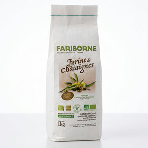 A 1kg bag of FARIBORNE Farine de Châignes flour standing on a wooden counter in a shop setting.