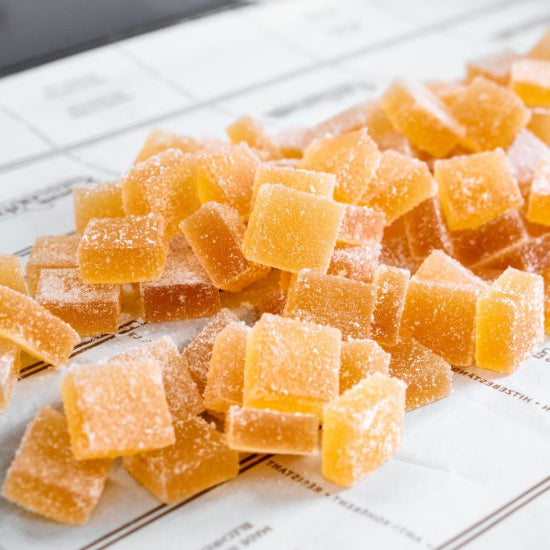Gummy candy pieces on a newspaper background